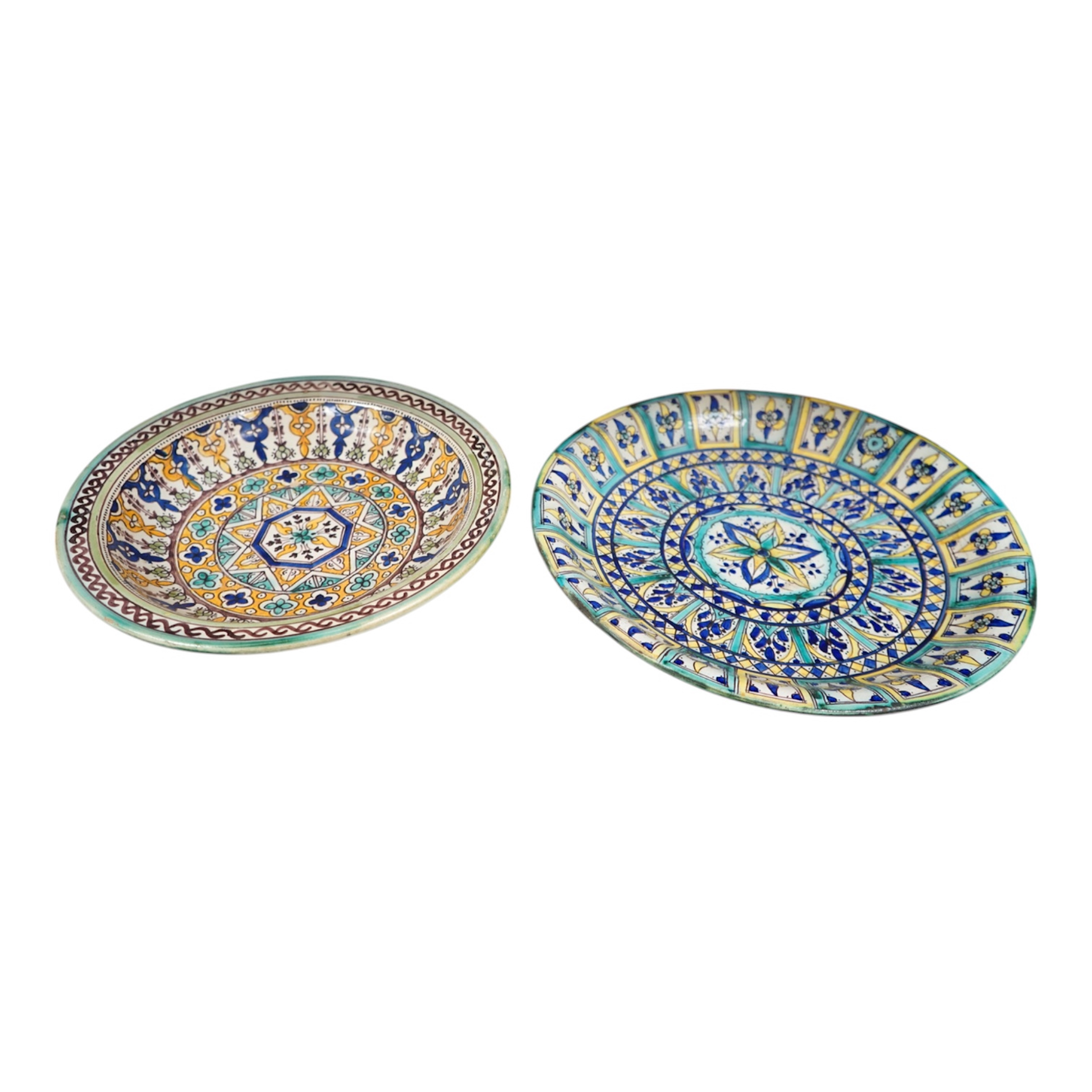 Two 19th/20th century Moroccan polychrome pottery dishes, 41cm diameter. Condition - fair to good